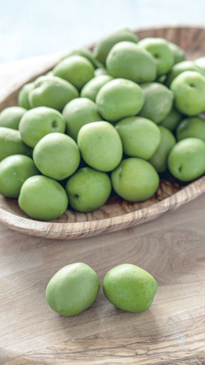 High angle view of green fruits on table
