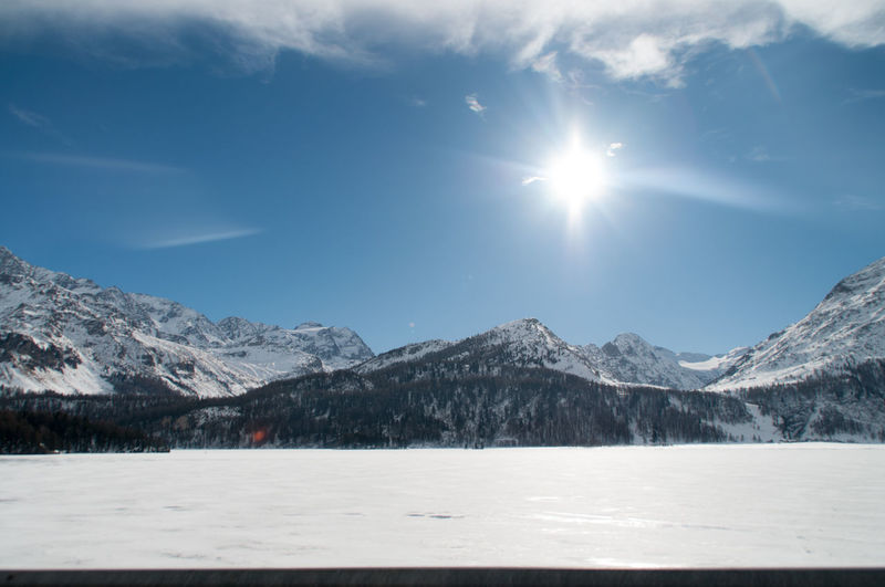 Scenic view of snow covered mountains against sky
