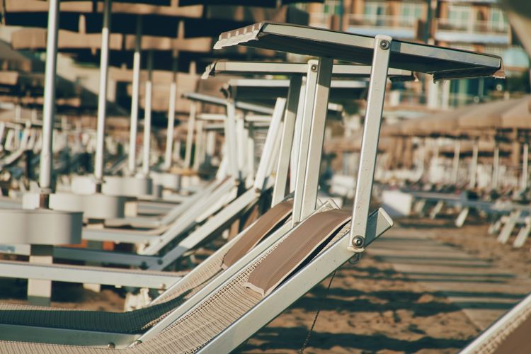 Close-up of empty beach chairs 