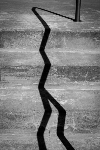 High angle view of man shadow on street