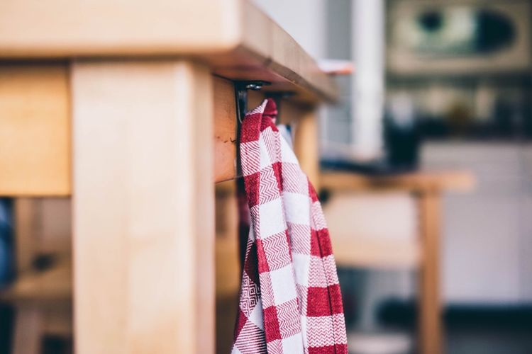 Close-up of clothes hanging on wood