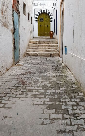 Alley amidst buildings in city