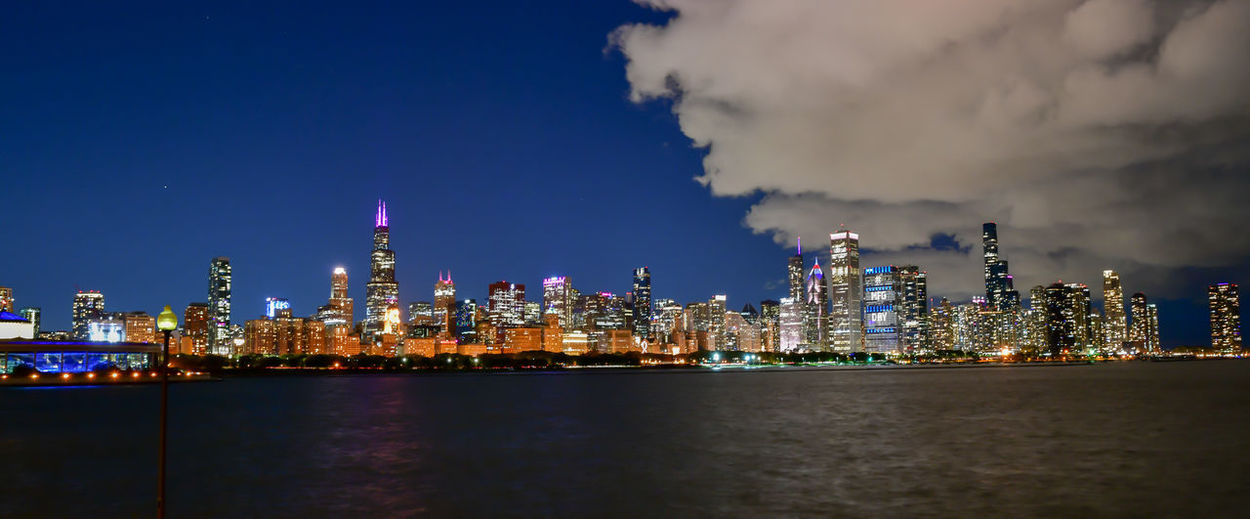 Illuminated buildings in city at night