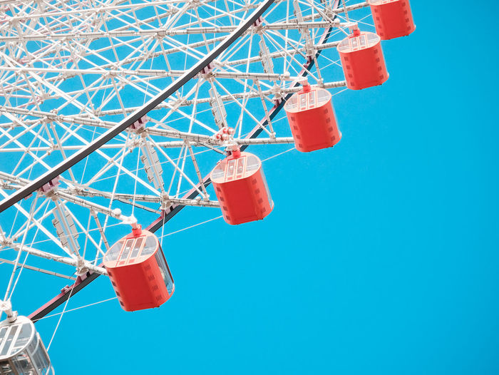Low angle view of ferris wheel against sky