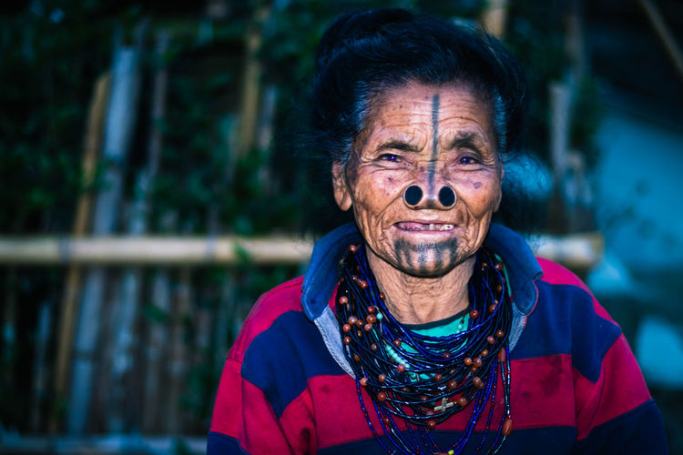 Portrait of smiling senior woman outdoors