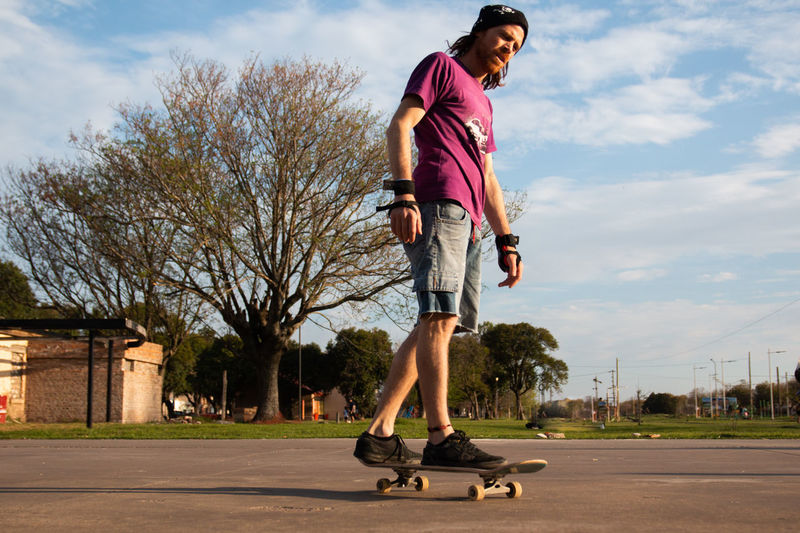 Portrait of skateboarder at sunset