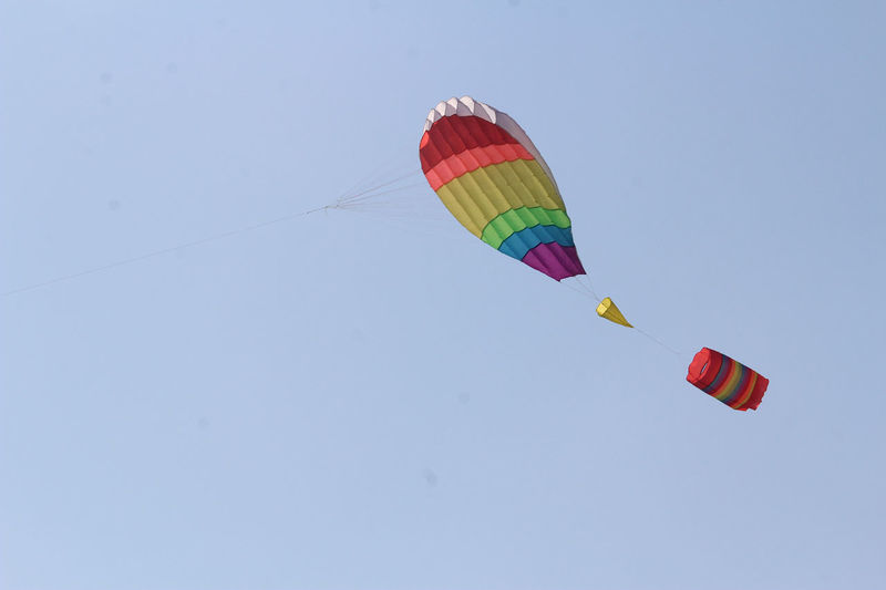 Low angle view of kite flying against clear sky