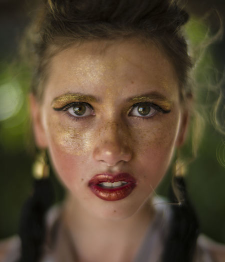 Close-up portrait of teenage girl with make-up