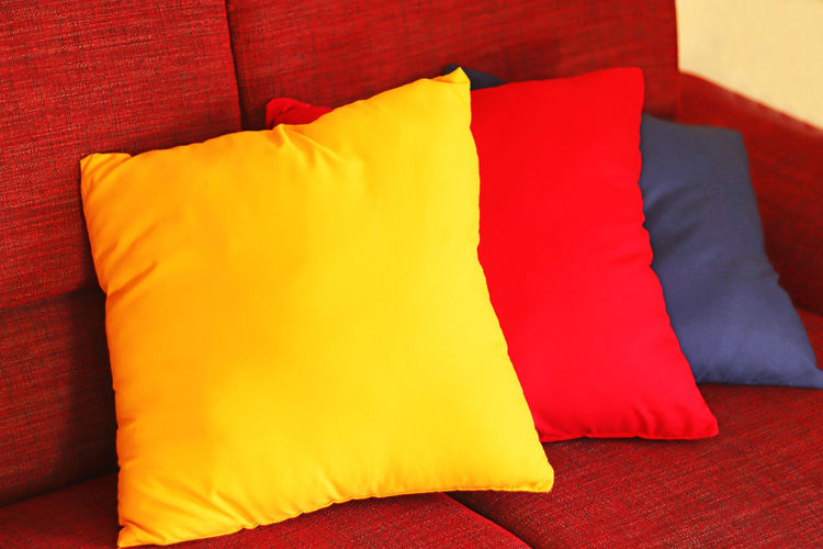High angle view of multi colored sofa on bed