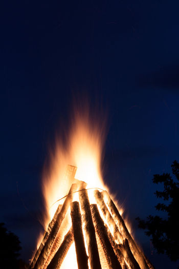 Low angle view of bonfire against sky at night