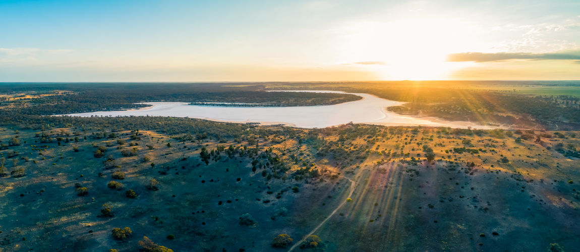 Scenic view of landscape against sky during sunset