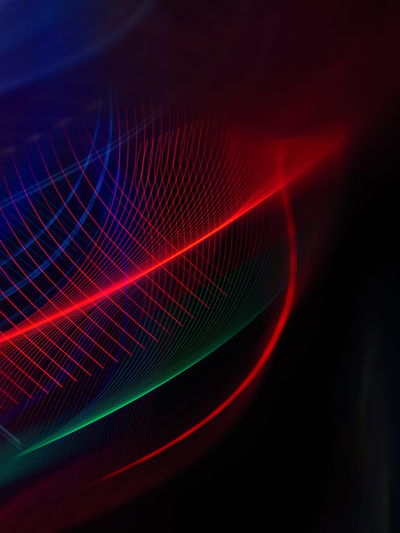 Close-up of light painting against abstract background