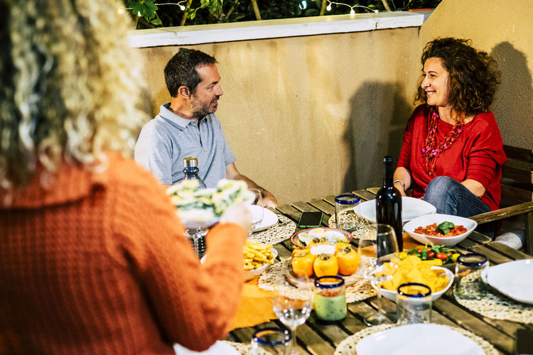 Cheerful people enjoying dinner