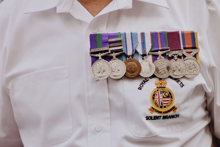 Midsection of soldier with medals