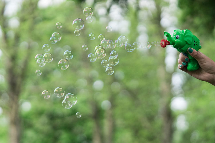 Person holding bubbles