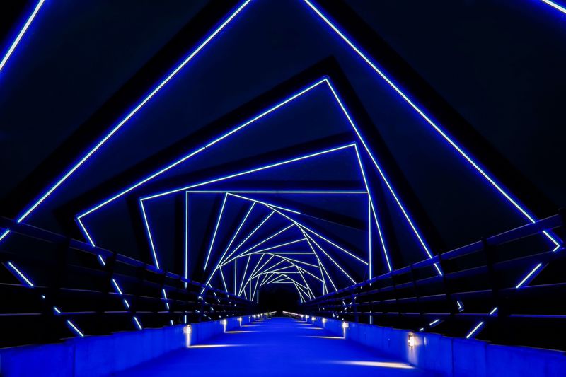Futuristic bridge with blue light pattern