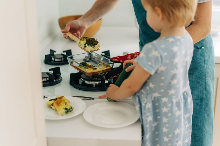 Midsection of woman preparing food on table