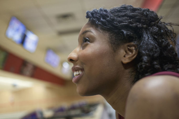 A young woman smiling.