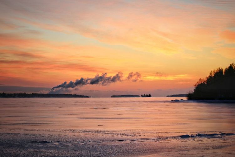 Scenic view of sea at sunset
