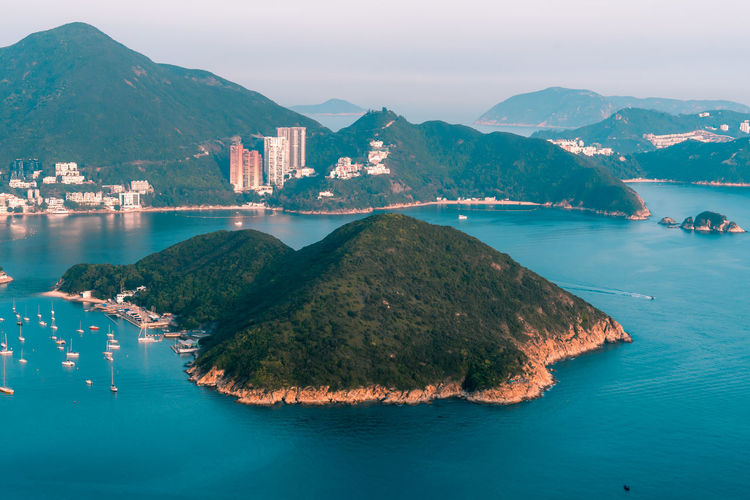 View of boats middle islands buildings in seaside at deep water bay hong kong seen form brick hill