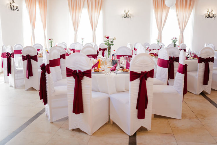 Dining tables arranged during wedding ceremony
