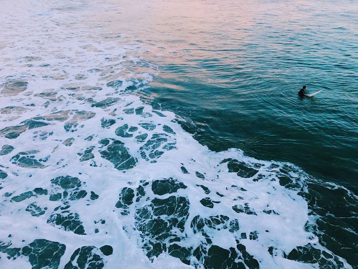 High angle view of man surfing in sea
