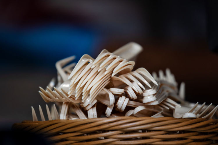 Close-up of stack of plastic forks