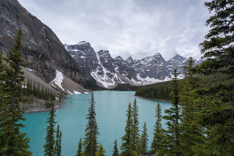 View on beautiful alpine lake with turquoise waters surrounded by magnificent peaks, canada