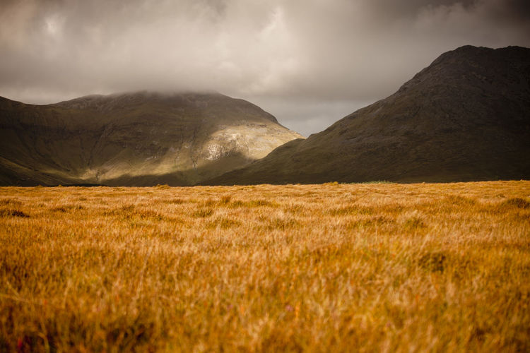 Scenic view of connemara mountains against sky