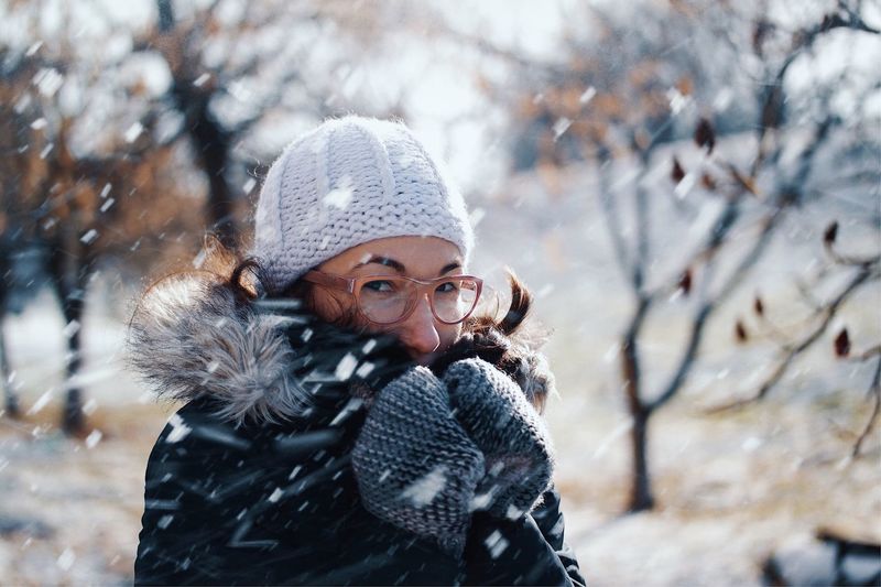 Portrait of mid adult woman during snowfall