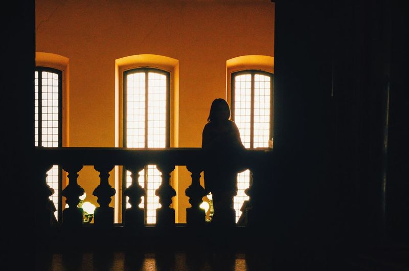 Woman in dark room