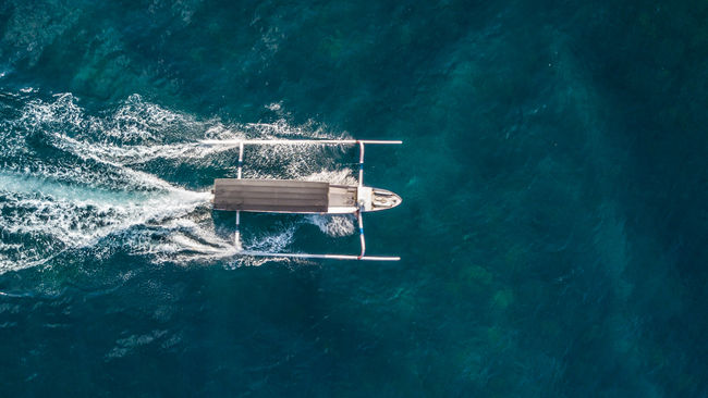 Drone view of boat sailing on sea