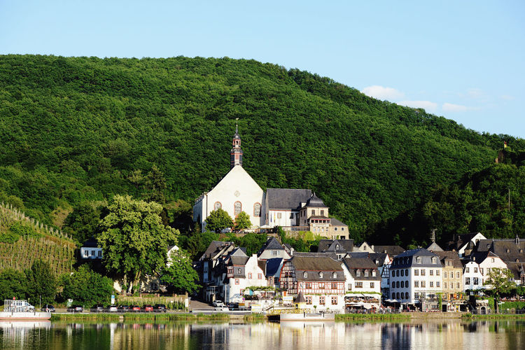 Moselle river against buildings and mountain