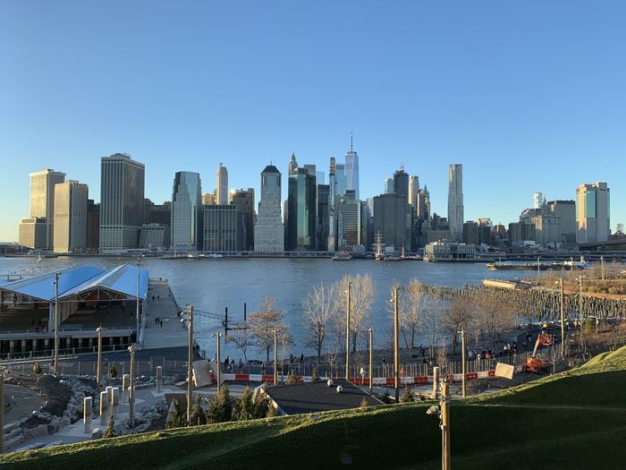 Modern buildings in city against clear sky