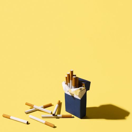 High angle view of pencils on yellow background