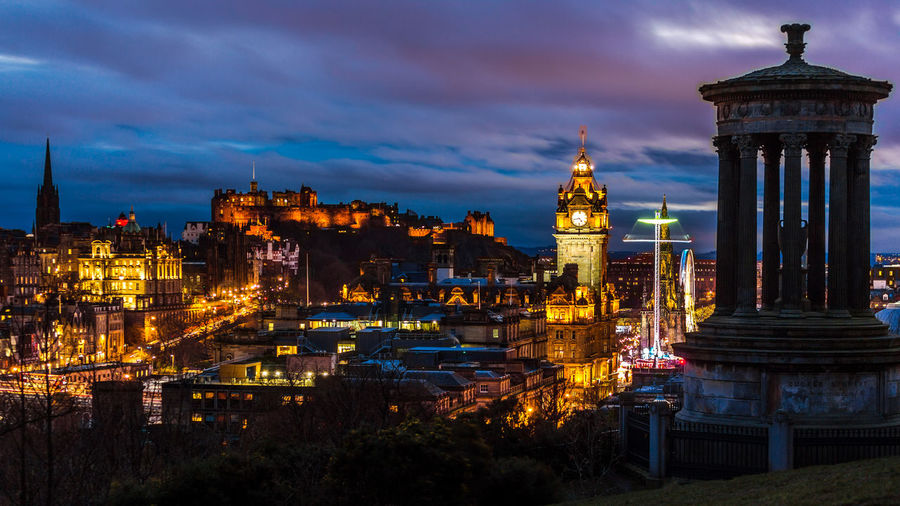 Illuminated buildings in city at night