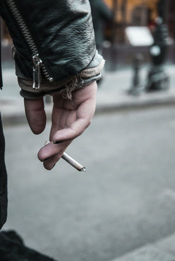 Close-up of woman hand holding marijuana joint