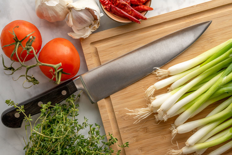 High angle view of chopped vegetables on cutting board
