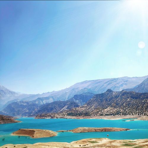 Scenic view of lake against blue sky
