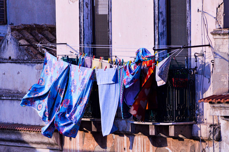 Clothes drying on clothesline outside building