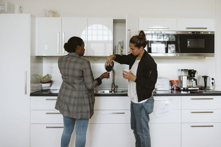 Women having coffee in kitchen