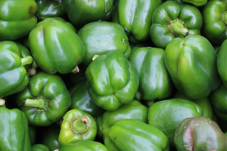 Full frame shot of green chili pepper for sale in market