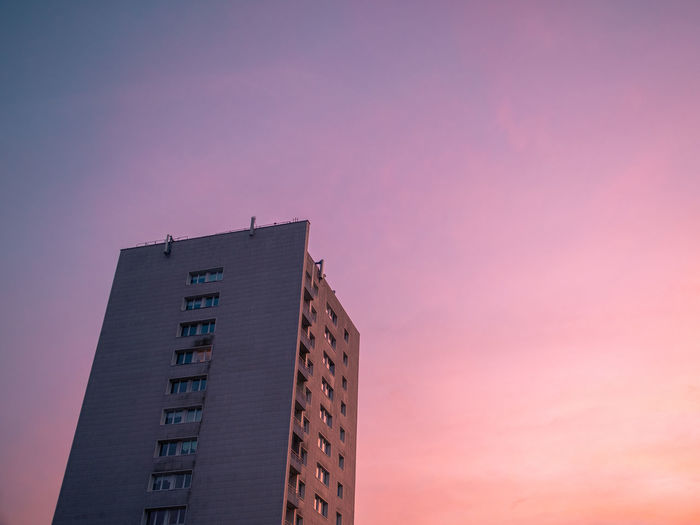 Low angle view of building against sky during sunset