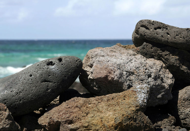 Rocks on shore against sea
