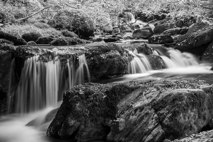 Long exposure of a waterfall on the hoar oak water river at watersmeet in exmoor 