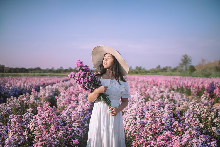 Woman standing on lavender field