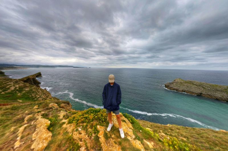 Man looking at sea against sky