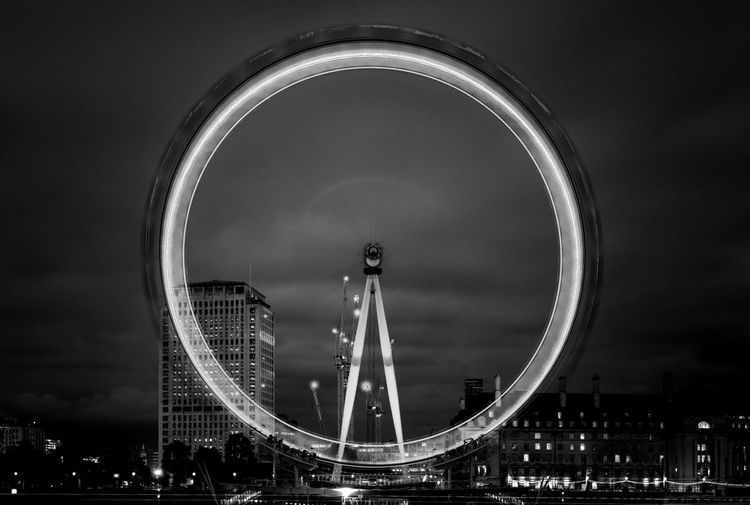 Low angle view of ferris wheel against sky