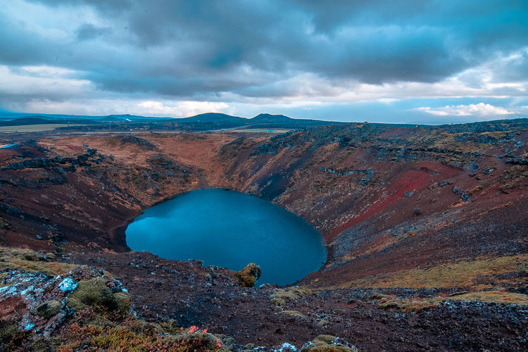 Scenic view of crater lake against sky
