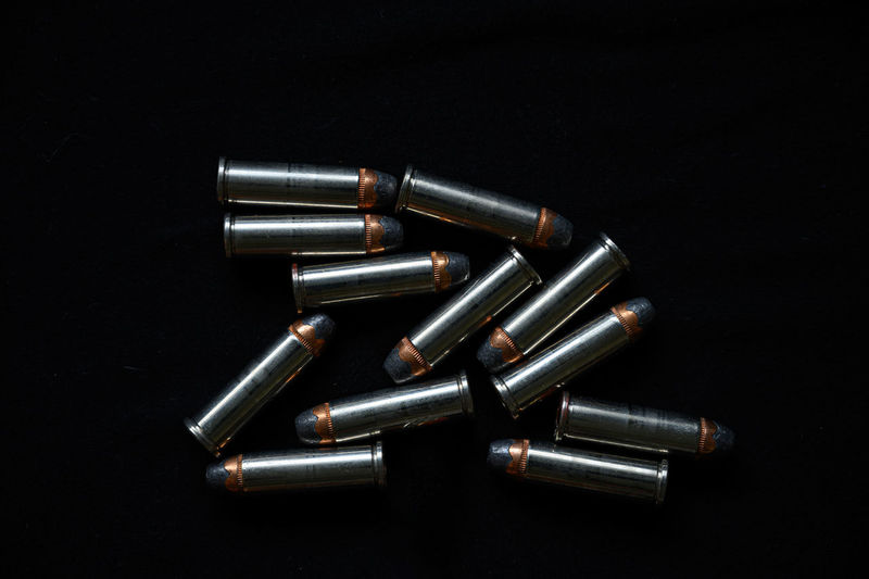 High angle view of piano keys on table against black background